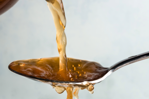 Apple cider vinegar in a spoon